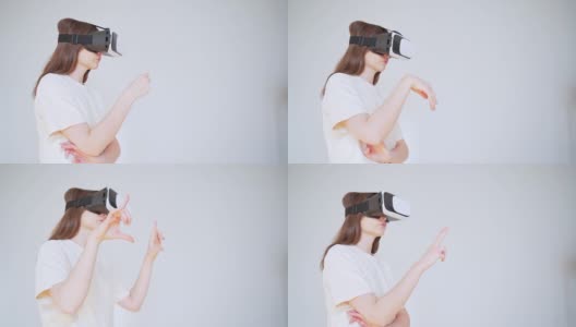 在网上购物。一名戴着虚拟现实头盔的年轻女子在网上挑选礼物高清在线视频素材下载