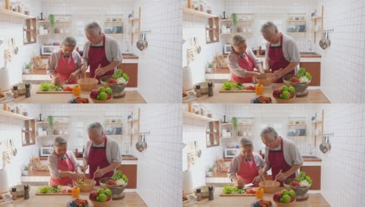 4K亚洲老夫妇一起在厨房做沙拉。高清在线视频素材下载