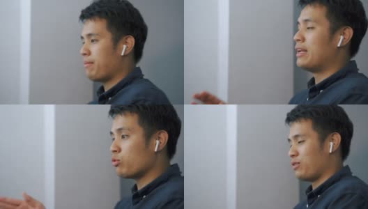 一名亚洲男子在家庭办公室用笔记本电脑与客户视频通话。高清在线视频素材下载