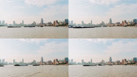 上海外滩历史建筑在晴朗多云的日子从浦东看，船舶在黄浦江上航行，时间推移4k镜头，b卷拍摄。高清在线视频素材下载