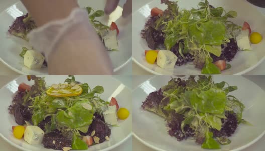 厨师的手端上配有肝脏的沙拉高清在线视频素材下载