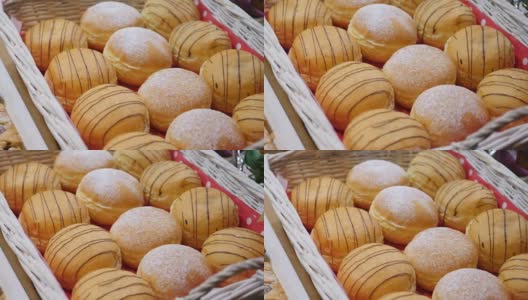 新鲜的甜甜圈装在盒子里卖，镜头在移动高清在线视频素材下载