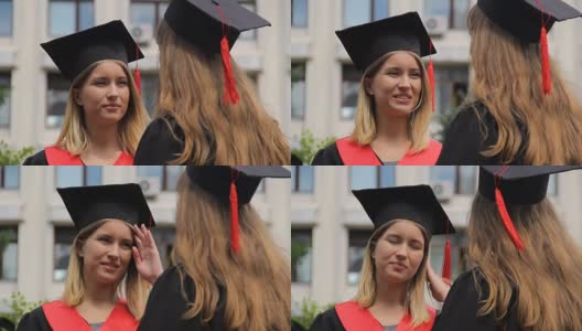 两个年轻的女毕业生在毕业典礼后讨论未来的计划高清在线视频素材下载