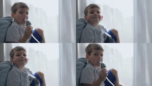 哮喘治疗，儿童在医院通过吸入器呼吸特写高清在线视频素材下载