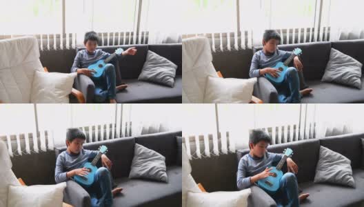 懒惰的男孩躺在沙发上高清在线视频素材下载