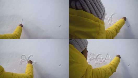 和平。冬天的旅人在雪地里写留言。享受冬山和厚厚的积雪。肖像。高清在线视频素材下载