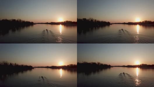 职业运动员在日落时练习划艇。高清在线视频素材下载