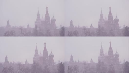 俄罗斯，莫斯科，护城河上最神圣的Theotokos的代祷大教堂，以及冬日雪地里的克里姆林宫。在暴风雪天气中的瓦西里大教堂高清在线视频素材下载
