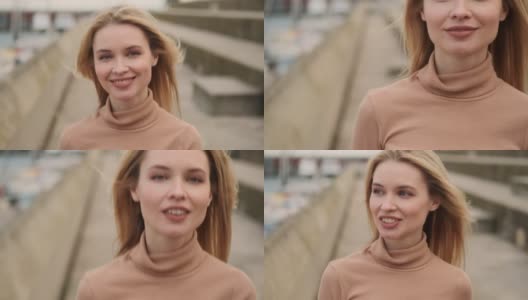 近距离拍摄美丽的微笑的金发女孩快乐地走在海滨高清在线视频素材下载