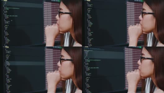 女人看着桌面屏幕检查程序员编码高清在线视频素材下载