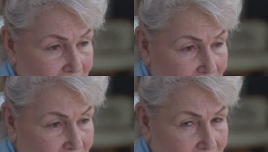 闭上抑郁绝望的老妇人的眼睛，看向别处，看着摄像机。悲伤沮丧的白人女性退休与绝望的面部表情在室内。老化的概念高清在线视频素材下载
