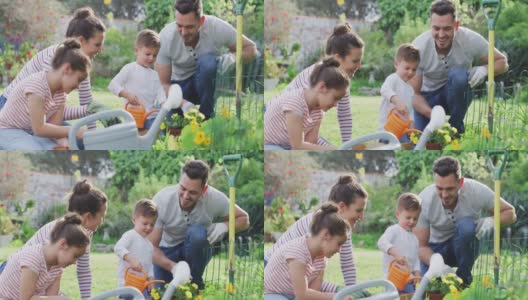 幸福的白种人家庭一起园艺和浇灌植物高清在线视频素材下载