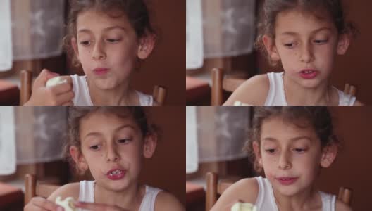 一个小女孩吃煮鸡蛋的特写镜头高清在线视频素材下载