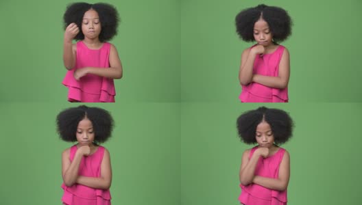 年轻悲伤的非洲女孩，留着非洲式发型，一边往下看一边思考高清在线视频素材下载