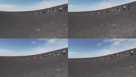 埃特纳火山顶上的游客高清在线视频素材下载