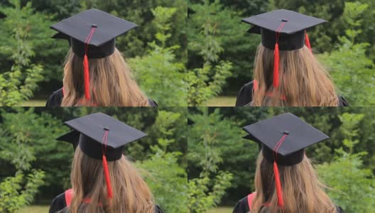 女朋友们戴着带流苏的毕业帽在学校附近聊天高清在线视频素材下载
