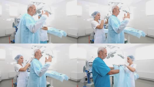 助手在手术室给外科医生穿手术服高清在线视频素材下载