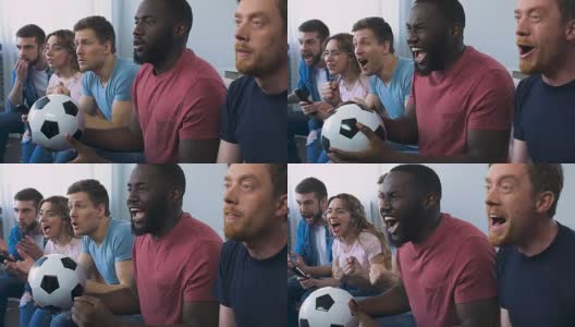 一群朋友在电视上看足球比赛，进球后大声欢呼高清在线视频素材下载