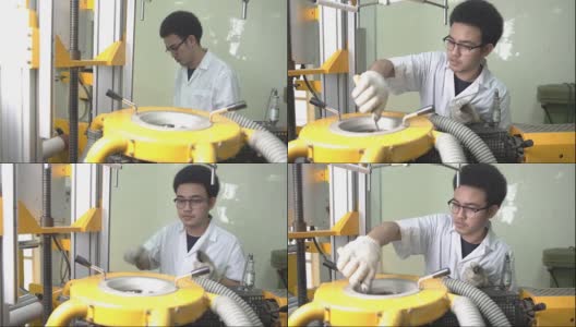 淘洗:年轻科学家清理吹膜挤出机的模具高清在线视频素材下载