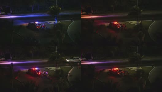 警察在夜间靠近汽车高清在线视频素材下载