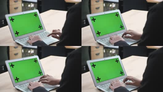 女商人使用绿色屏幕的笔记本电脑高清在线视频素材下载