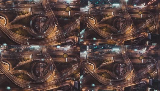 4K超高清俯视图延时在香港城市的多车道高速公路，蜿蜒的道路和回旋处的夜间汽车交通。通勤者，城市生活，或陆地交通概念。缩小的相机高清在线视频素材下载