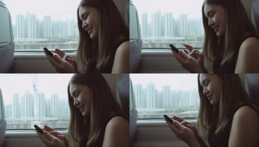 在高铁上，女性用手机拍摄外部景色高清在线视频素材下载