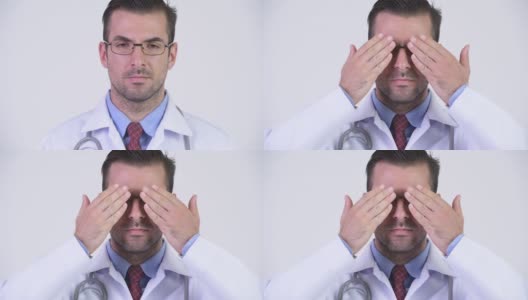 年轻英俊的西班牙裔医生戴着眼镜高清在线视频素材下载