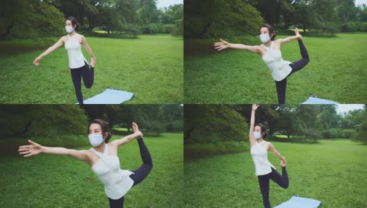 瑜伽教练戴着防护口罩单腿站立，在公园里伸直手高清在线视频素材下载
