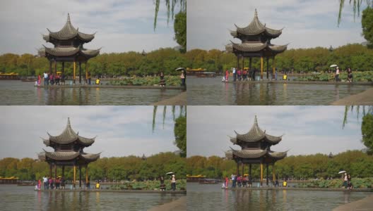 杭州市区晴天著名的西湖湾拥挤的码头湾宝塔慢镜头全景4k中国高清在线视频素材下载