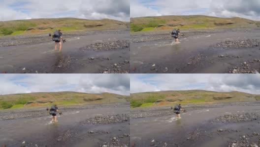 一名年轻人从冰岛的兰德马纳洛格尔出发，穿越结冰的河流，全程54公里高清在线视频素材下载