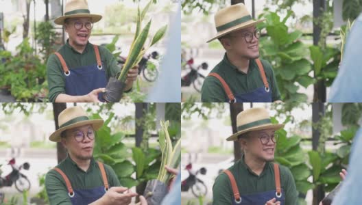 4K亚洲男性客户使用智能手机银行的非接触式支付购买室内植物高清在线视频素材下载