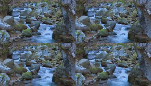 一条纯净的河流流淌在巨大的石块之间高清在线视频素材下载