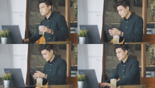 微笑的专业年轻亚洲中国商人工作使用笔记本电脑在露天咖啡馆高清在线视频素材下载