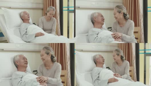 慈爱的亚洲老妇人在医院病房探望丈夫高清在线视频素材下载