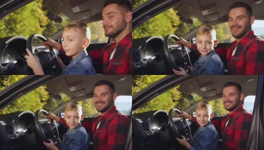满意的35岁的胡子父亲和可爱的微笑男孩坐在掌舵和摆姿势在驾驶课上高清在线视频素材下载