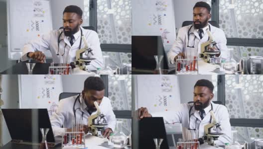 英俊有经验的非裔美国医生开始与显微镜和电脑在现代医疗办公室工作高清在线视频素材下载