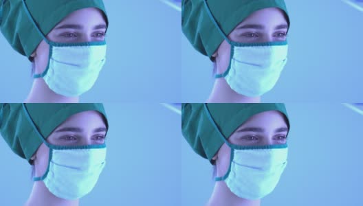 近距离手术女医生在面具和微笑高清在线视频素材下载