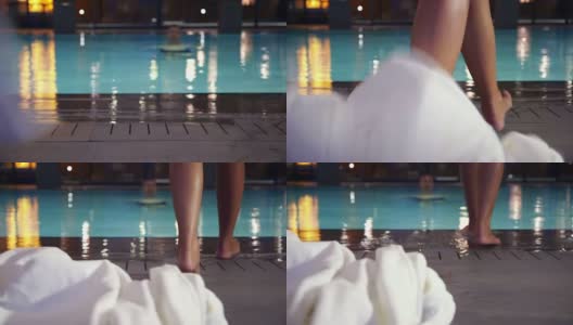一个女人在酒店靠近游泳池高清在线视频素材下载