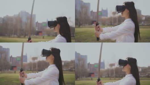 中国女孩戴着虚拟现实眼镜看剑。风吹在头发上。高清在线视频素材下载