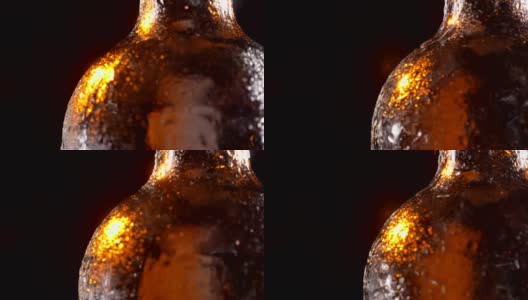 特写拍摄的闪光啤酒瓶与冷露从它旋转旋转的运动高清在线视频素材下载