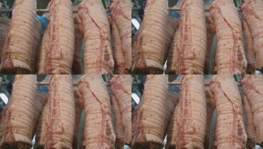 肉制品加工厂货架上的开胃猪肉卷高清在线视频素材下载