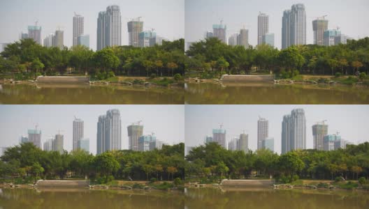 白天时间佛山城市公园池塘住宅综合体建设慢镜头全景4k中国高清在线视频素材下载