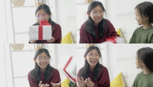 快乐的亚洲女孩在家里一起争夺礼盒，庆祝节日的概念。高清在线视频素材下载