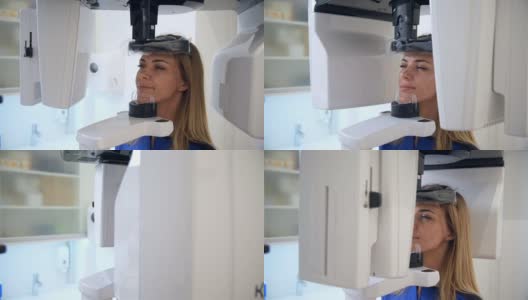 一位女性患者站在牙科计算机断层扫描仪前。高清在线视频素材下载