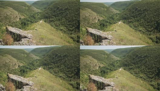 无人机拍摄的摩尔多瓦山谷，山坡上覆盖着郁郁葱葱的绿色植物高清在线视频素材下载