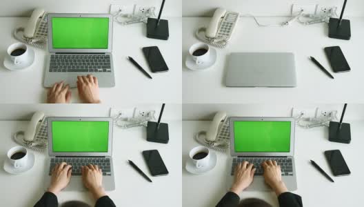 女商人在办公桌上打开笔记本电脑，用绿色屏幕打字，4K(超高清)高清在线视频素材下载