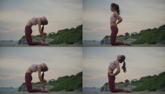年轻女子在山海练习瑜伽。高清在线视频素材下载