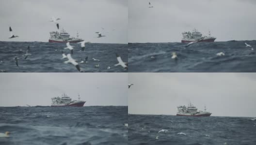 在波涛汹涌的海面上出海的渔船高清在线视频素材下载