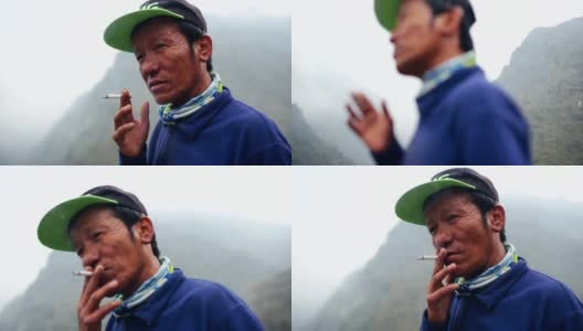 满脸皱纹的亚洲老头在户外抽烟高清在线视频素材下载